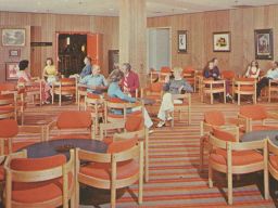 The cocktail lounge of a now-defunct resort in the Poconos. "Peaceful relaxation - healthful recreation," says the caption on the rear of the card. (Photograph by Pablo Iglesias Maurer, postcard published by Kardmaster Brochures)