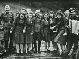 The photos were taken between May and December 1944, and they show the officers and guards of the Auschwitz relaxing and enjoying themselves — as countless people were being murdered and cremated at the nearby death camp. In some of the photos, SS officers can be seen singing. In others they are hunting and in another a man can be seen decorating a Christmas tree in what could only be described as a holiday in hell. 
